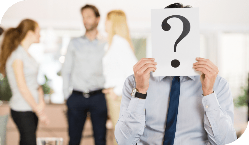 Question mark icon with a person reviewing answers on a laptop