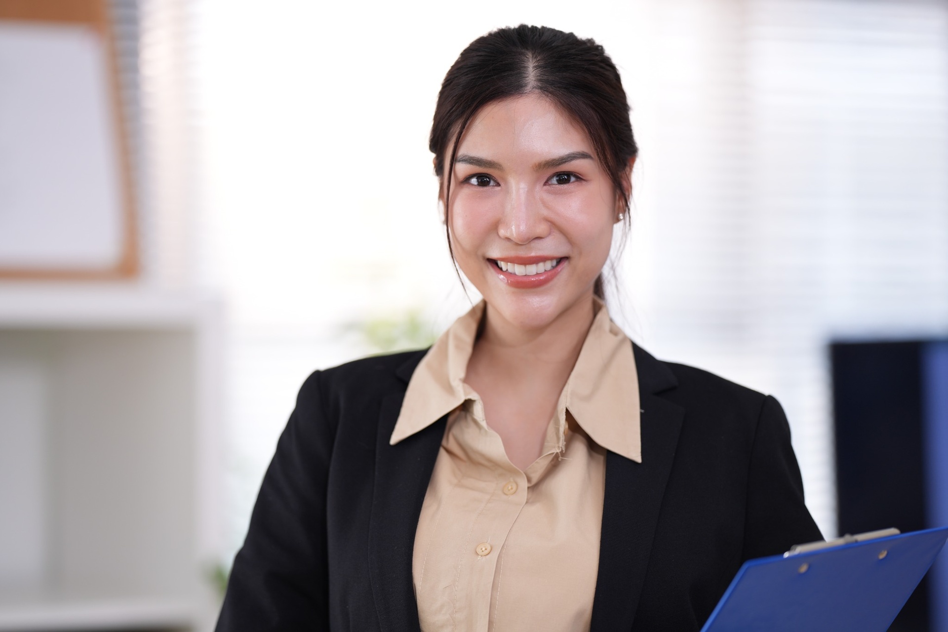 Chro holding clipboard in a professional office setting
